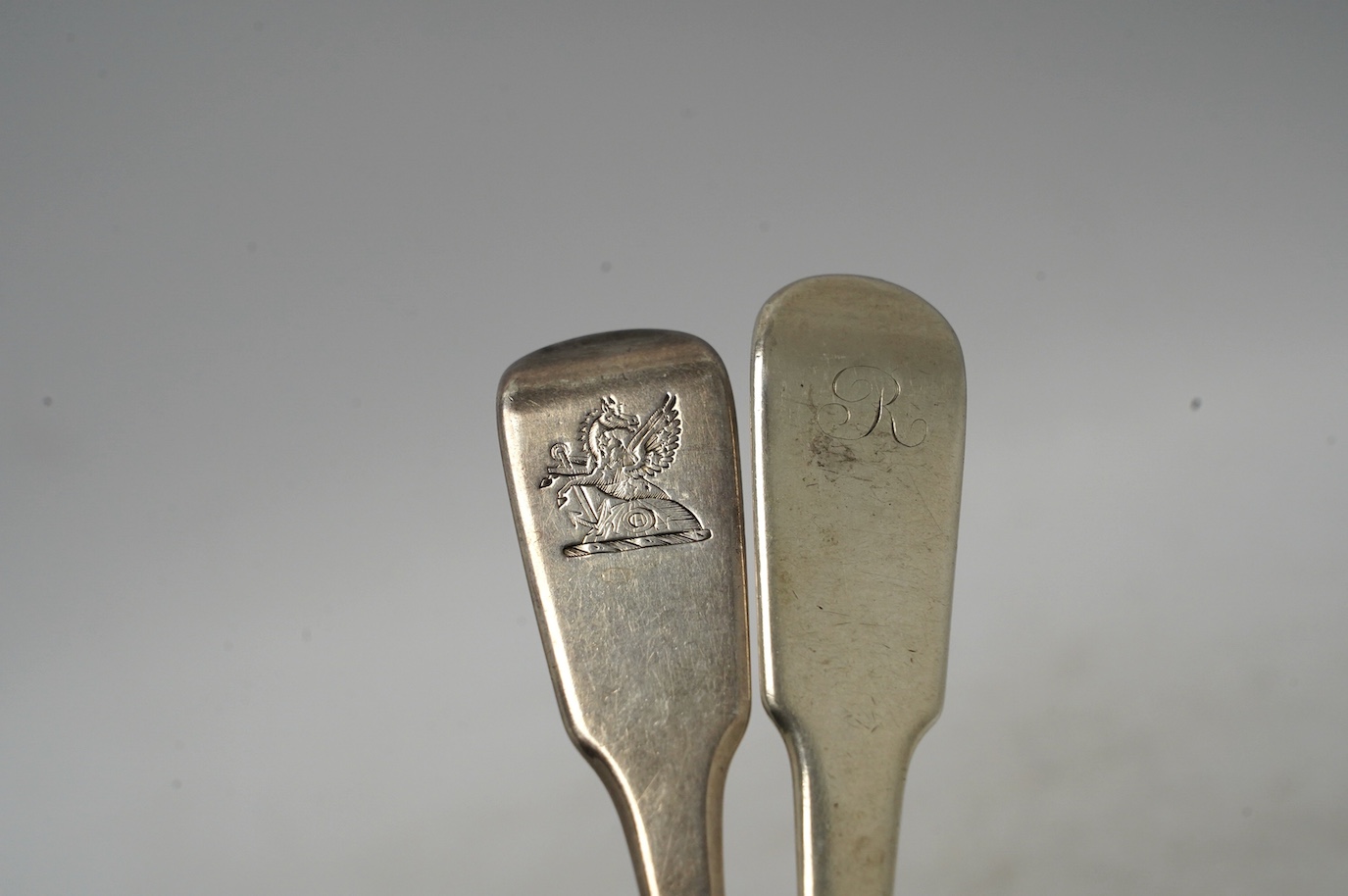 A George IV Scottish provincial silver fiddle pattern table spoon by Robert Keay I, Perth, circa 1825, 22.1cm, together with a George IV provincial silver fiddle pattern table spoon by Barber & Whitwell, York, 1821. Cond